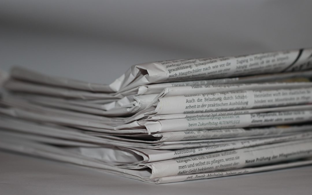 Stack of newspapers - history of news